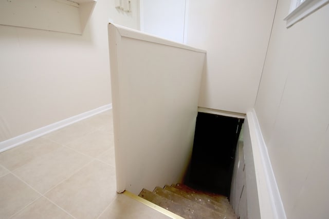 staircase with tile patterned floors