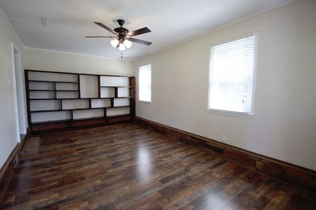 interior space with dark wood-type flooring, a textured ceiling, ceiling fan, and crown molding