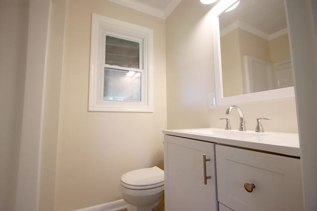 bathroom featuring vanity, toilet, and crown molding