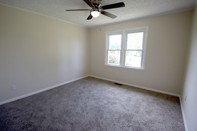 carpeted empty room with a textured ceiling and ceiling fan