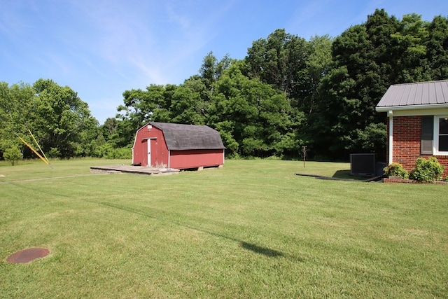 view of yard with a shed and central AC unit