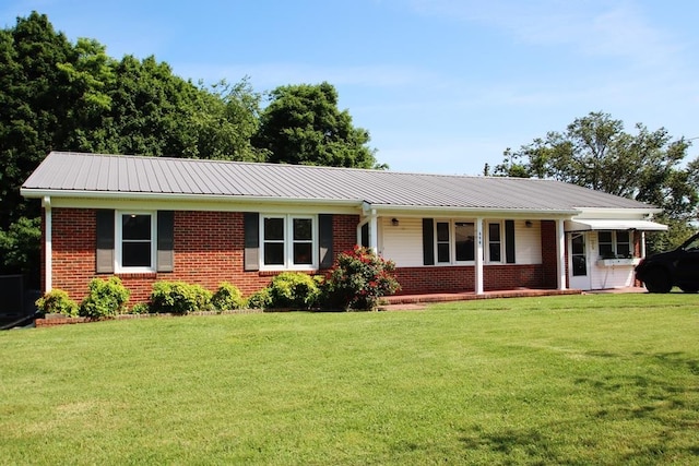 ranch-style home featuring a front yard