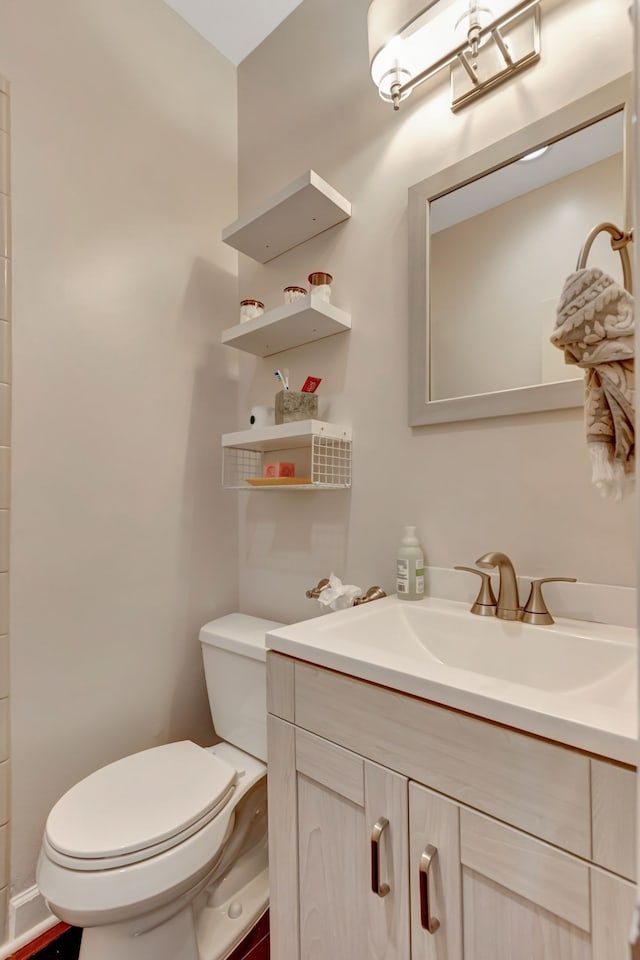 bathroom with vanity and toilet