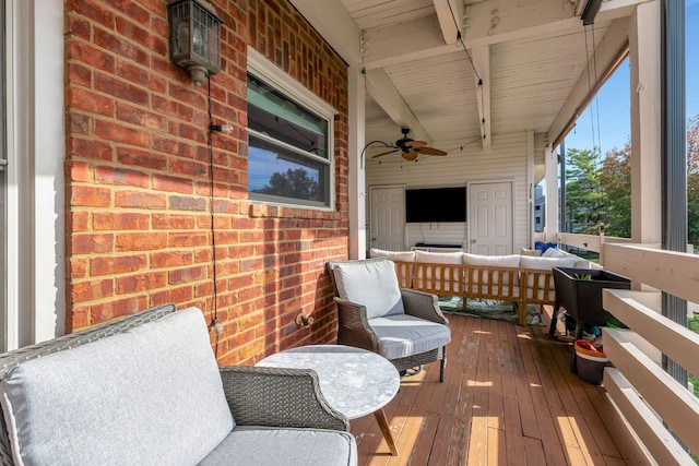 wooden terrace featuring ceiling fan