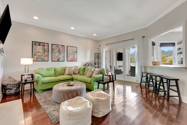 living room featuring hardwood / wood-style floors and ornamental molding