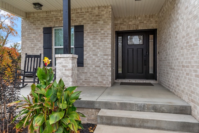 property entrance with a porch