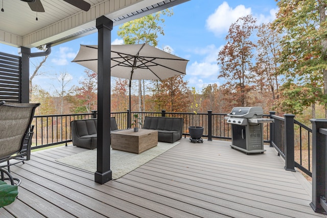 wooden terrace with grilling area and an outdoor living space