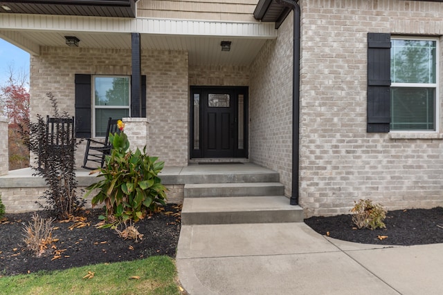 property entrance featuring a porch