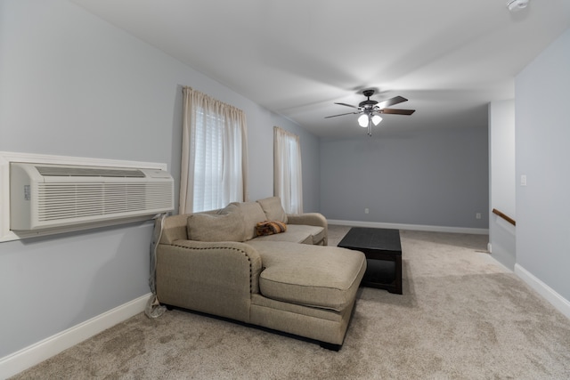 carpeted living room with ceiling fan