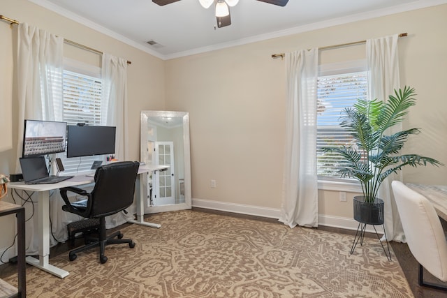 office area featuring ceiling fan, plenty of natural light, and ornamental molding