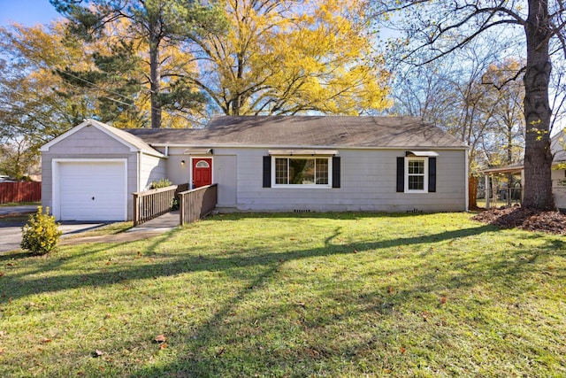 ranch-style home featuring a front lawn and a garage