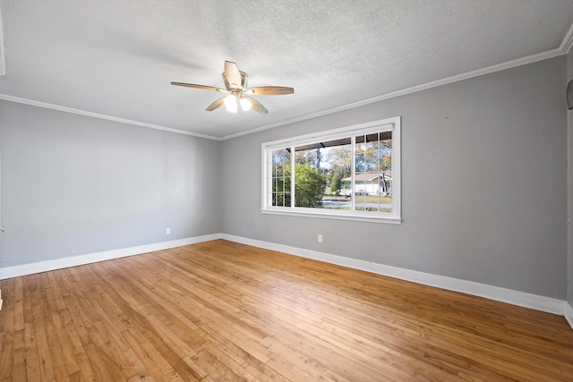 empty room featuring hardwood / wood-style flooring, ceiling fan, crown molding, and a textured ceiling