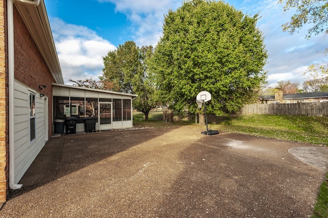 view of yard featuring a sunroom