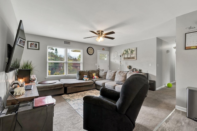 living room featuring ceiling fan and light carpet