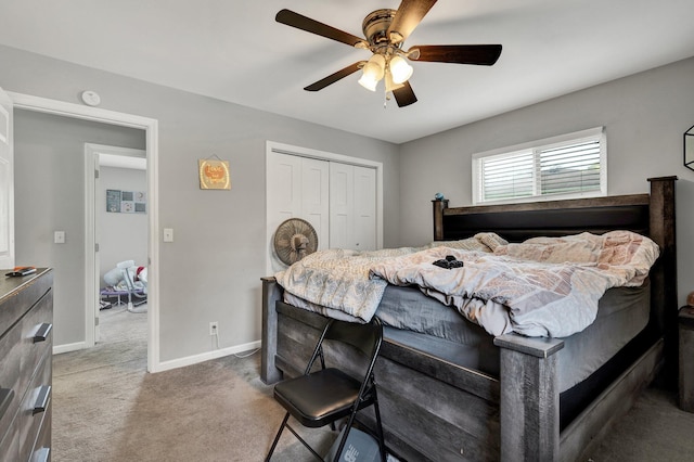 bedroom featuring ceiling fan, a closet, and carpet