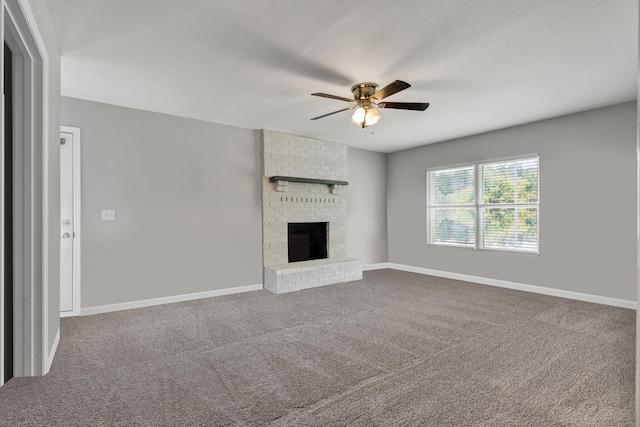 unfurnished living room featuring a fireplace, carpet floors, and ceiling fan