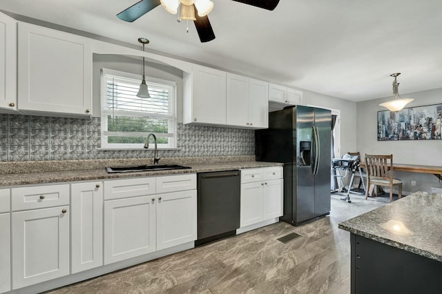 kitchen with stainless steel refrigerator with ice dispenser, white cabinets, sink, dishwasher, and hanging light fixtures