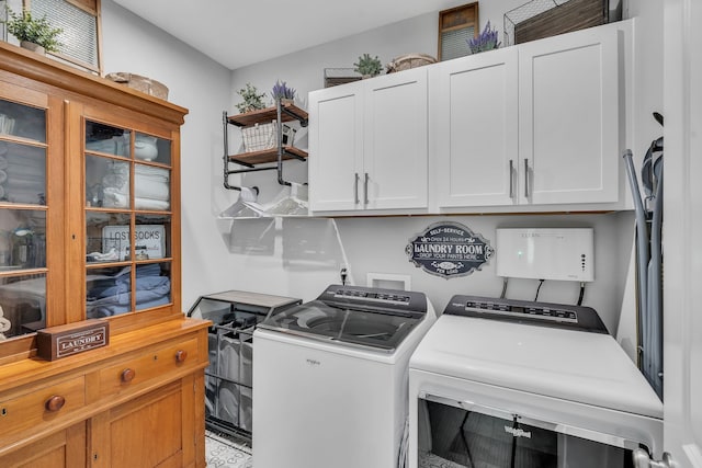 washroom with cabinets and independent washer and dryer