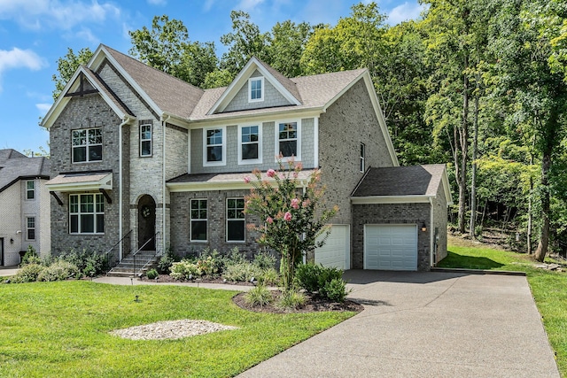 view of front of property featuring a garage and a front yard