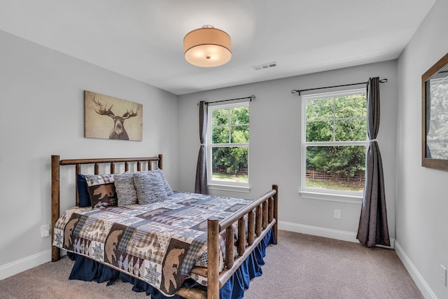 bedroom with light carpet