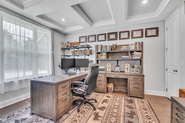 home office with ornamental molding, wood-type flooring, a healthy amount of sunlight, and coffered ceiling