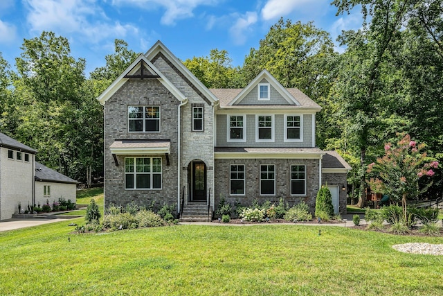 craftsman-style home with a front yard