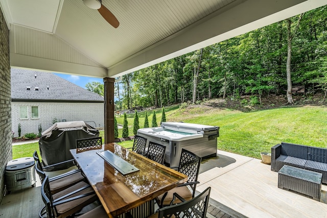 view of patio featuring a hot tub, area for grilling, and ceiling fan