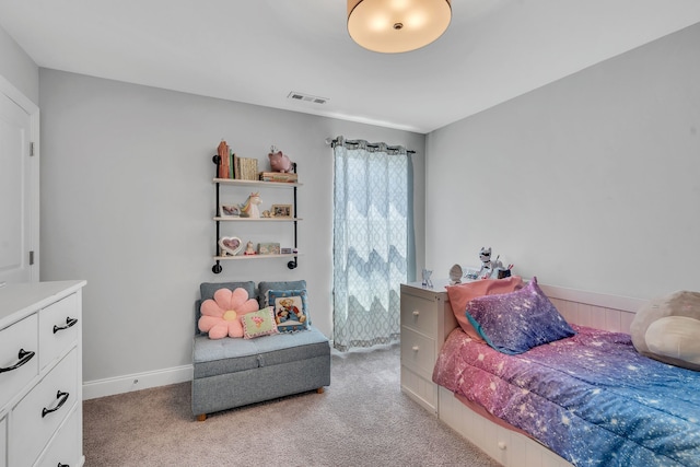 bedroom featuring light colored carpet