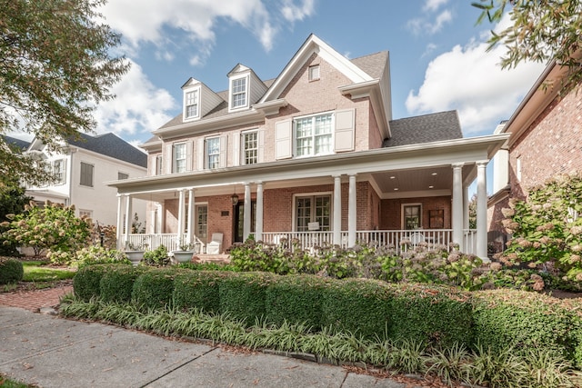 view of front of property featuring covered porch