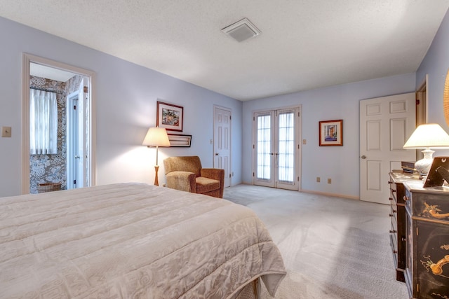 bedroom with light carpet, visible vents, baseboards, a textured ceiling, and french doors