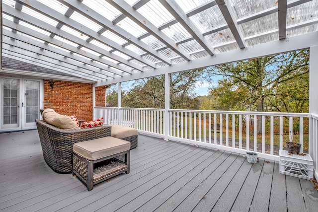 deck with french doors and a pergola