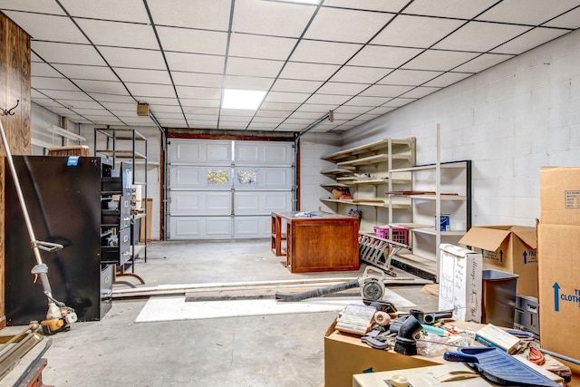 garage with concrete block wall