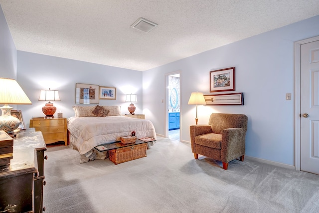 bedroom featuring a textured ceiling, carpet, visible vents, and baseboards