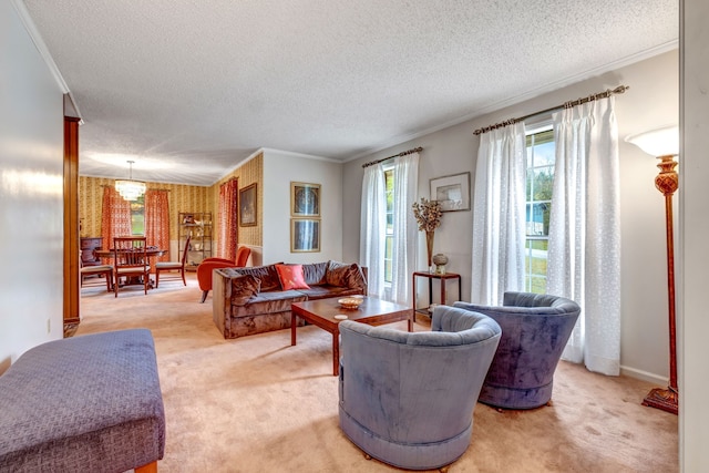 living area featuring ornamental molding, light carpet, and a textured ceiling