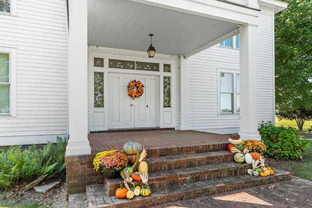 doorway to property featuring a porch