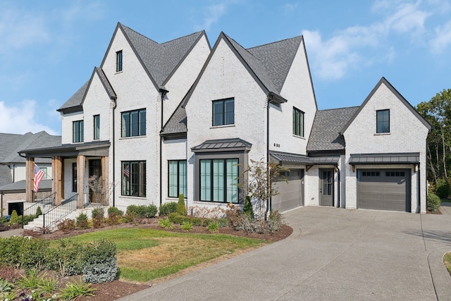 view of front of house featuring a garage and a front yard