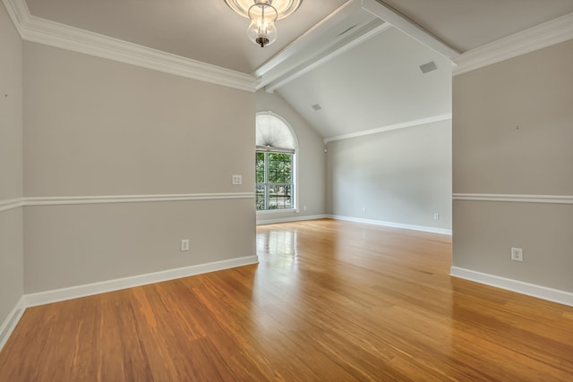 spare room featuring wood-type flooring, an inviting chandelier, lofted ceiling with beams, and ornamental molding