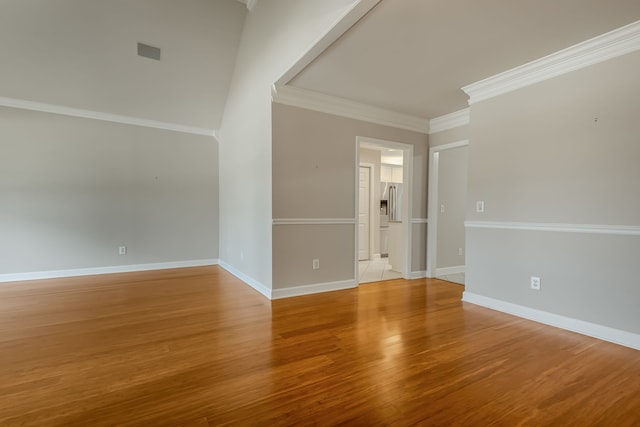 unfurnished room featuring light hardwood / wood-style floors and crown molding