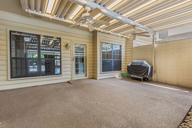 view of patio with ceiling fan and area for grilling