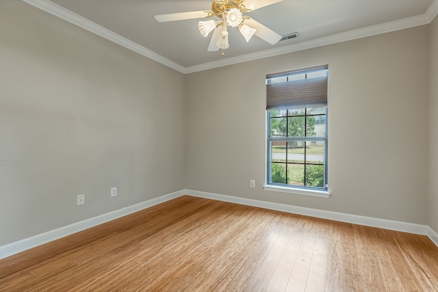 unfurnished room featuring ceiling fan, light wood-type flooring, and ornamental molding