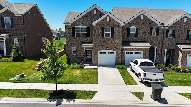 view of front facade with a front lawn and a garage