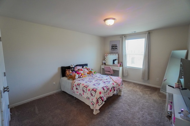 bedroom featuring dark carpet