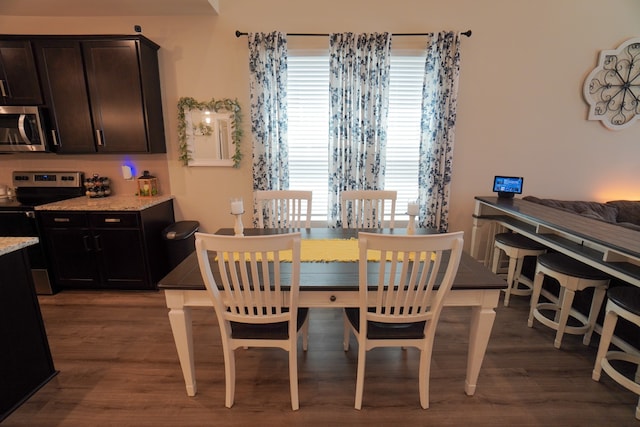 dining space featuring dark hardwood / wood-style flooring