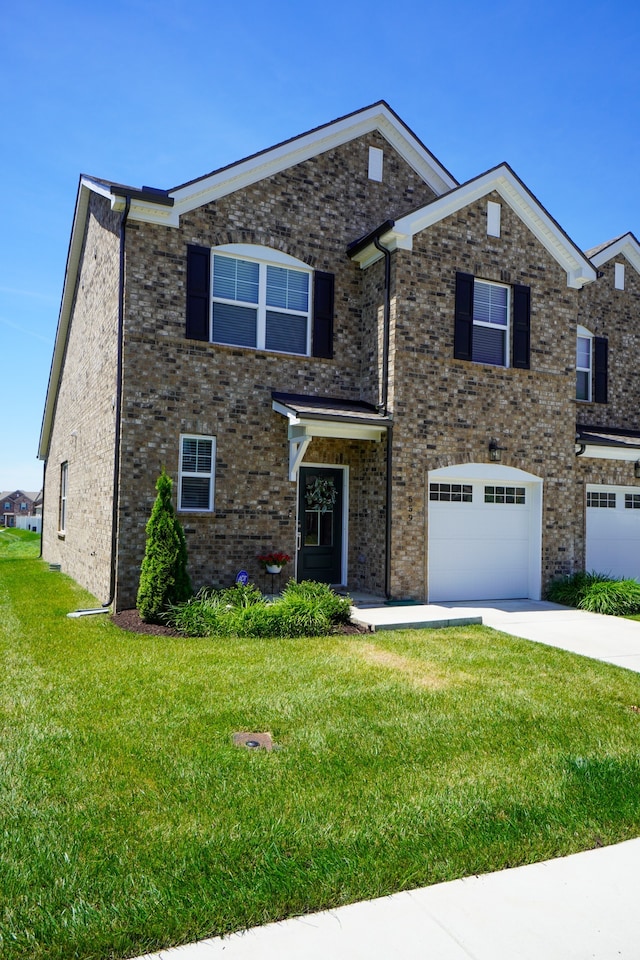 view of front of house featuring a garage and a front yard