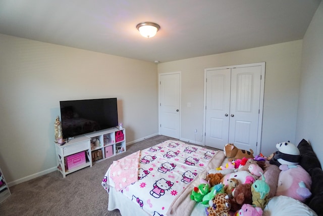 bedroom featuring a closet and carpet flooring