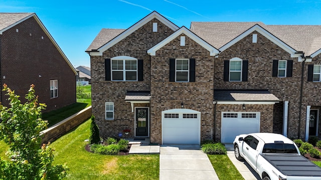 view of front of home with a garage and a front yard