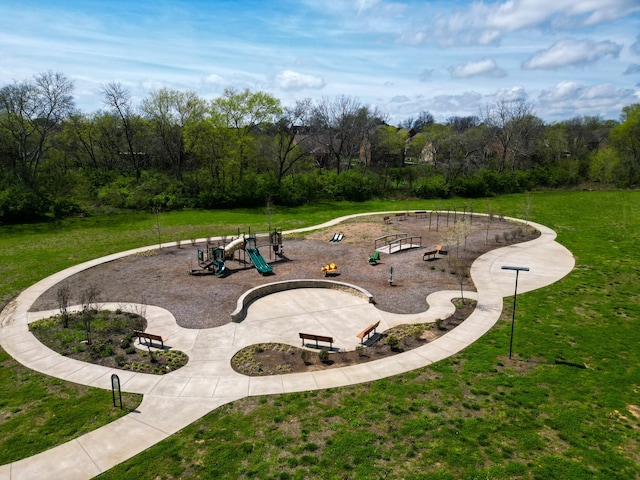 view of home's community featuring a playground and a yard