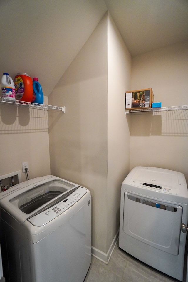 clothes washing area with independent washer and dryer