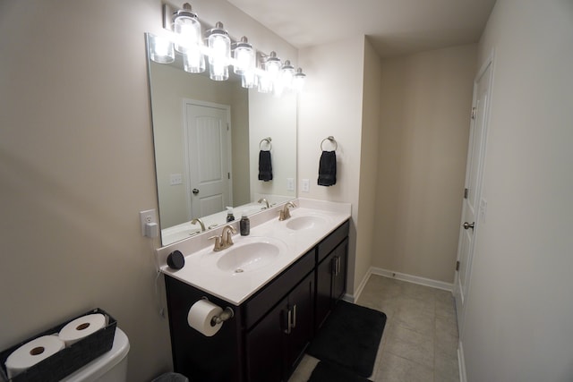 bathroom with vanity, tile patterned floors, and toilet