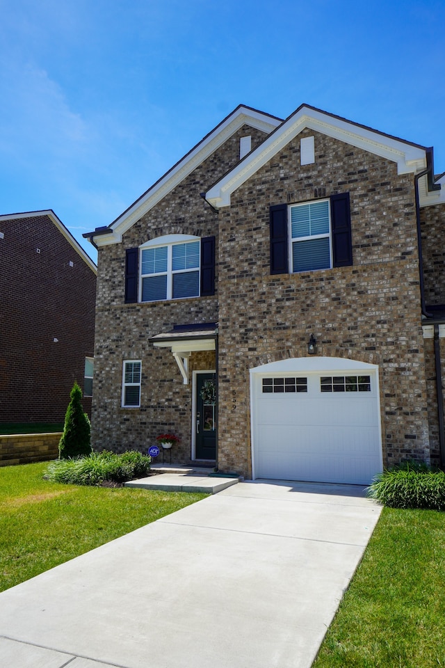 view of front of property with a garage and a front yard